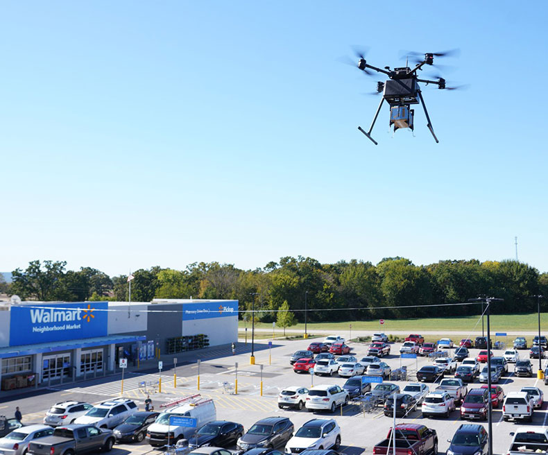 A drone delivers a package from a Walmart Supercenter..