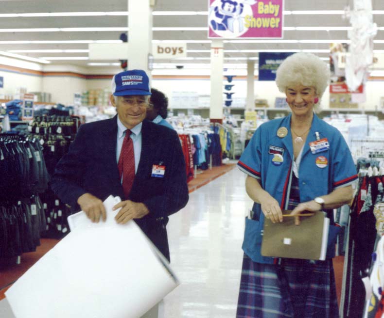 Sam Walton valued conversations with associates, as seen here during a Walmart store visit.