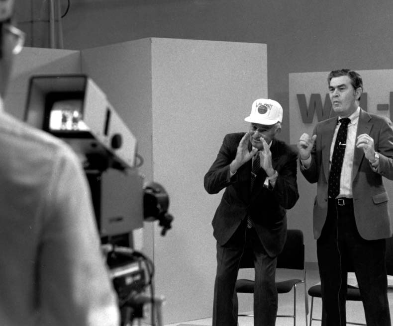 Sam Walton delivers one of his first live satellite broadcasts to stores.