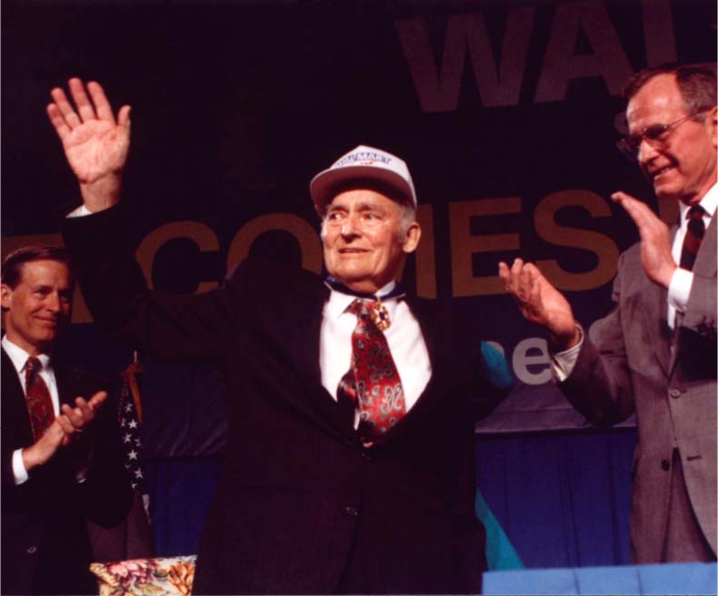 Sam Walton waves to audience during Medal of Freedom event.