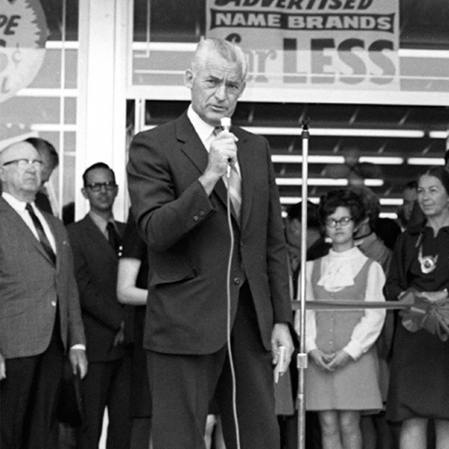 Mr Sam out front of a store