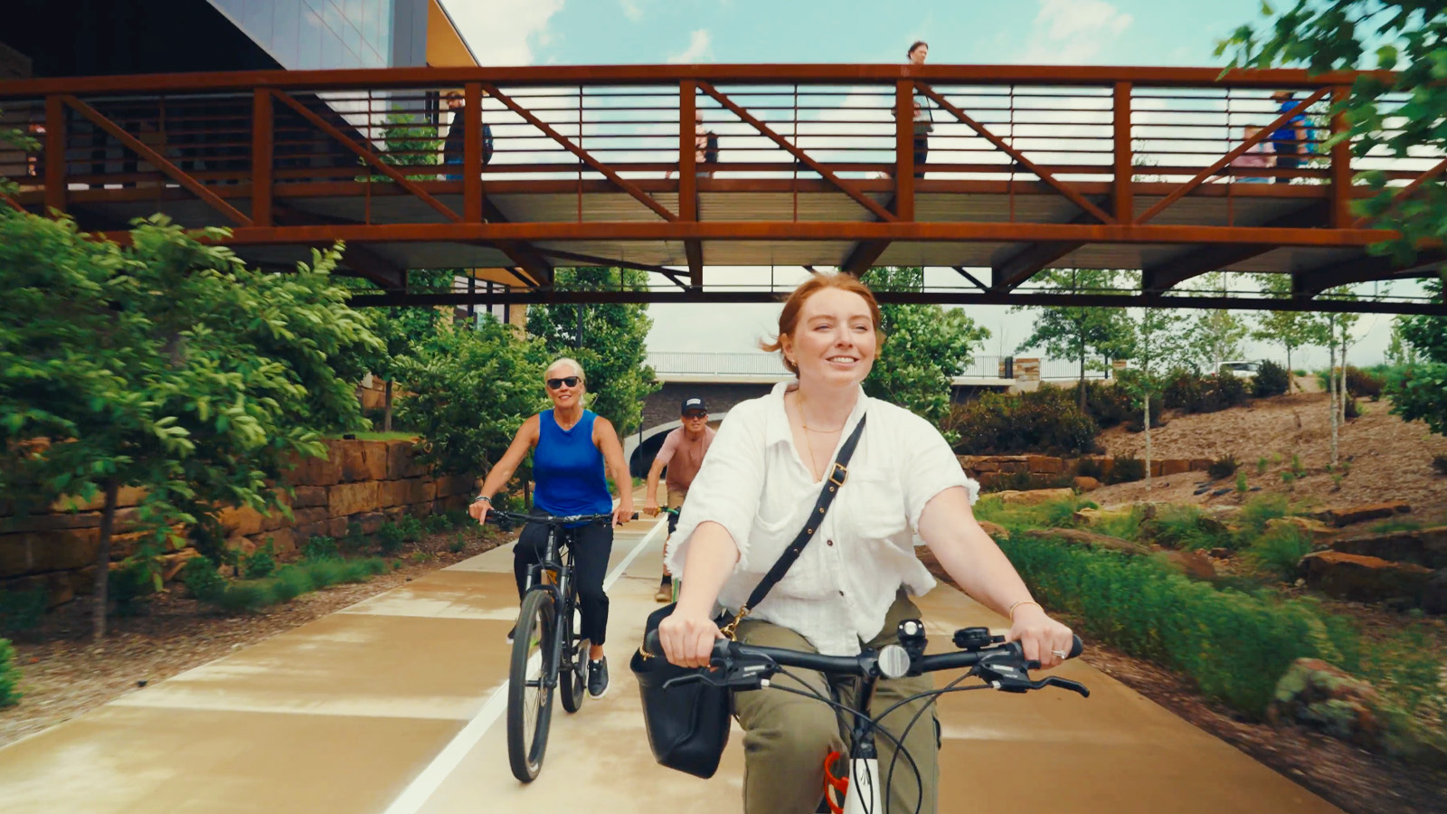 People riding bike on Walmart Campus
