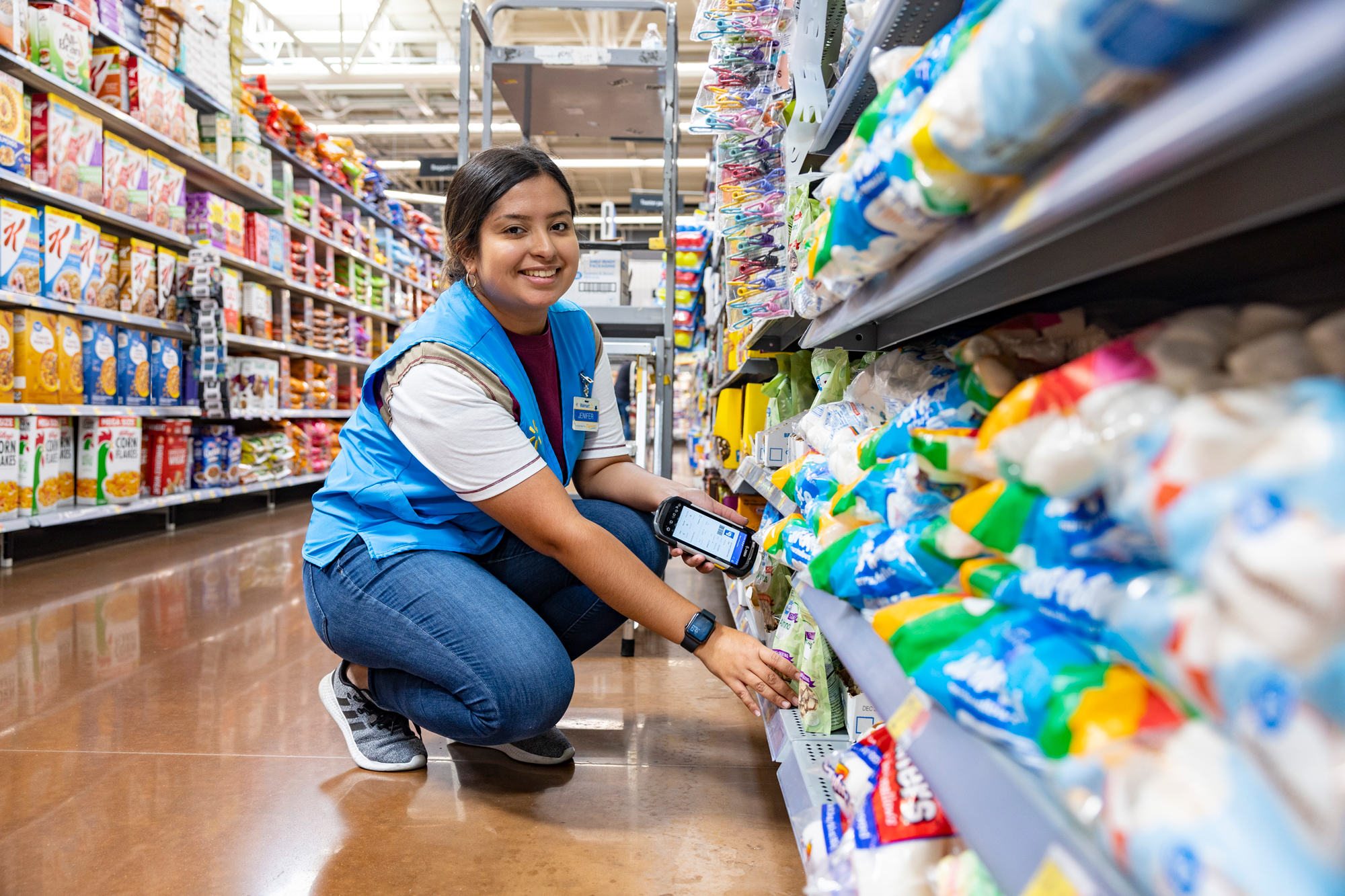 Associate scanning items in dry goods department