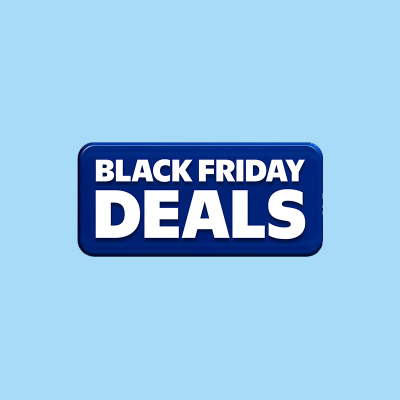 A close-up view of a holiday tree adorned with vibrant multicolored lights. The evergreen branches are illuminated with hues of blue, red, orange, and pink, creating a festive and cheerful atmosphere. The image captures the essence of holiday decor and celebration.