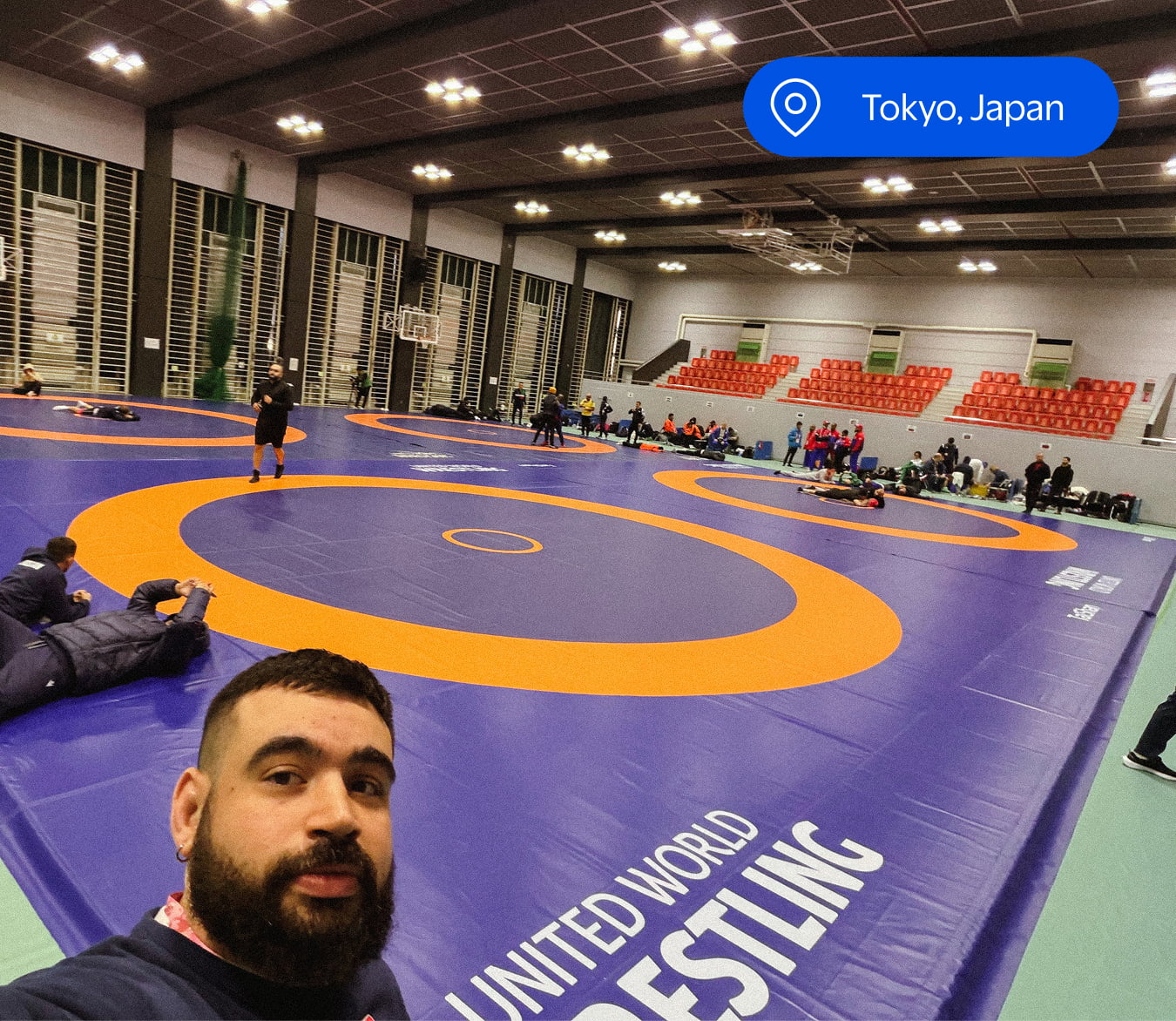 Harold Ramirez Jr. indoors at Ajinomoto National Training Center gymnasium with multiple wrestling mats.