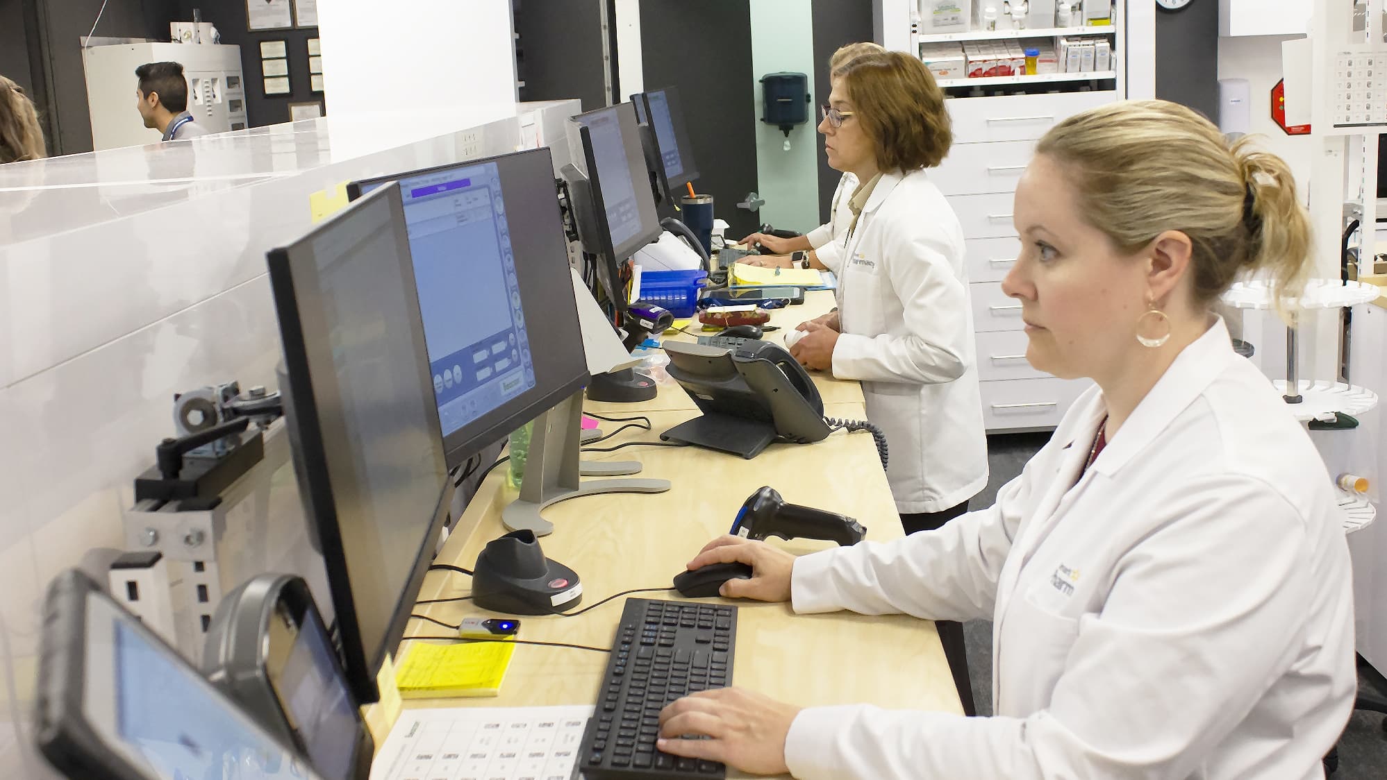 Pharmacist in front of computer