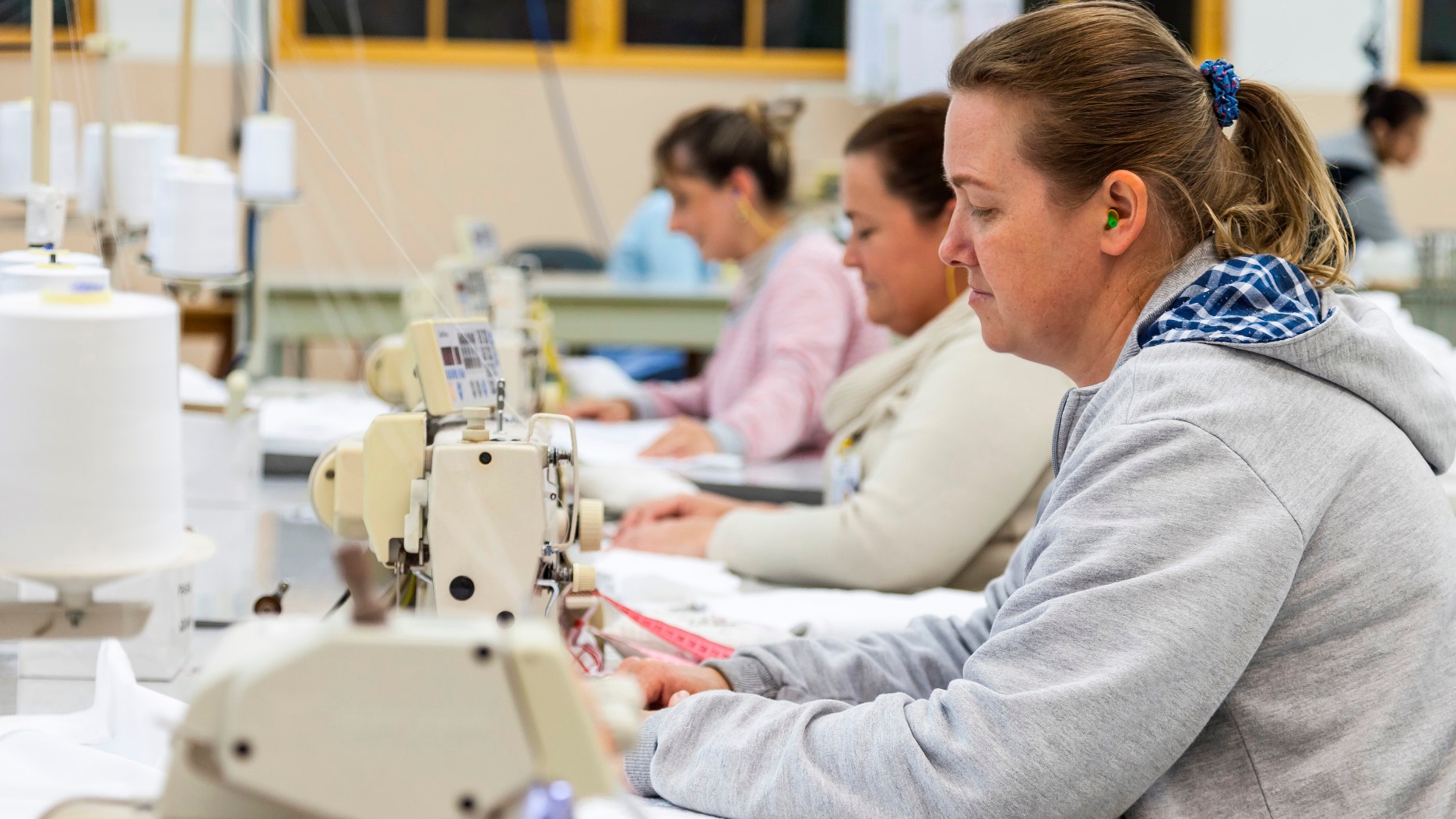 Workers sew in a factory 