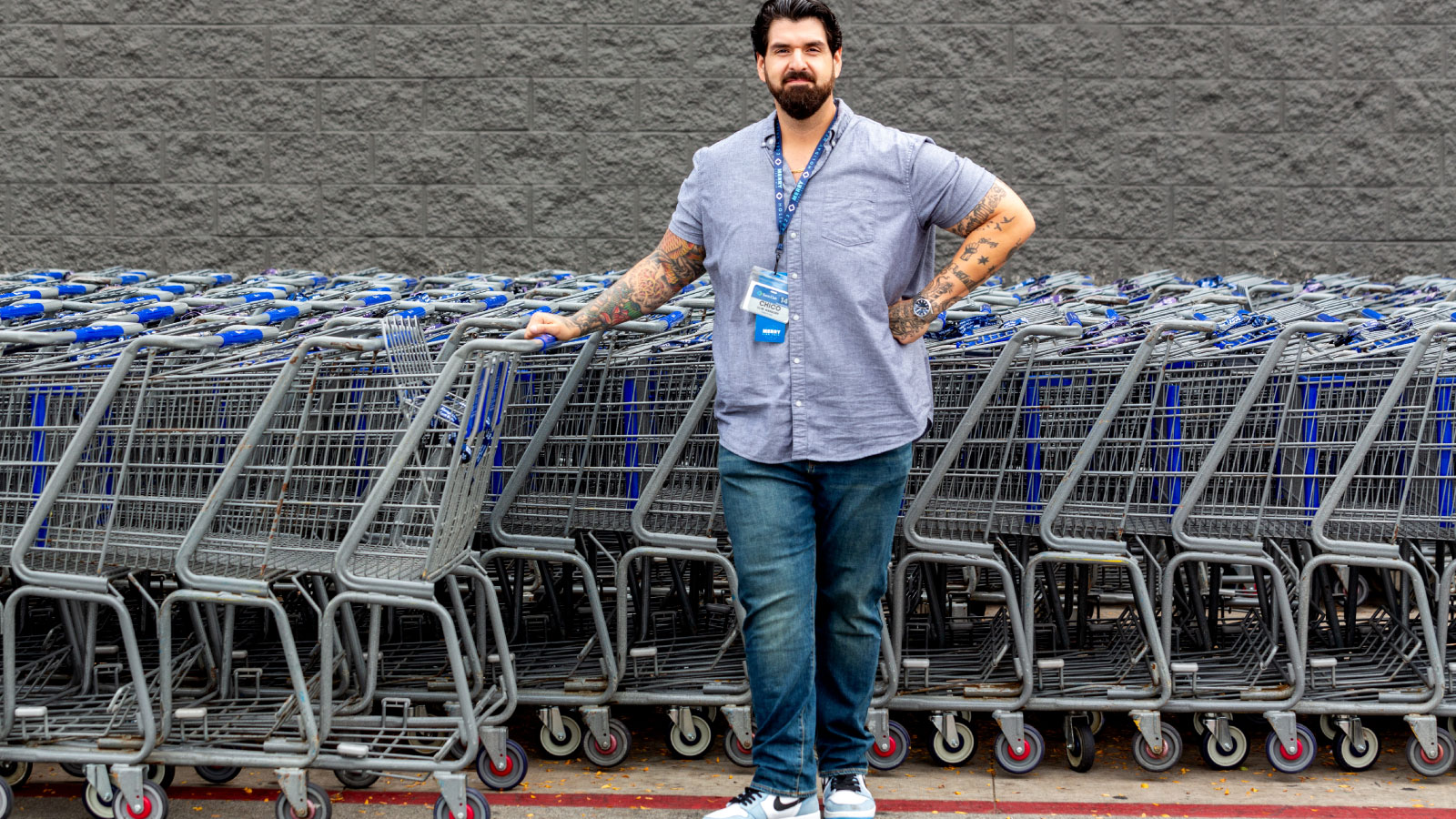Chico standing in front of carts outside a Sam's Club
